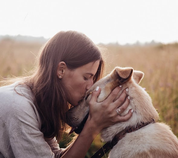 C.A.R.E.4Paws Animal Abuse Awareness Woman Kissing Dog