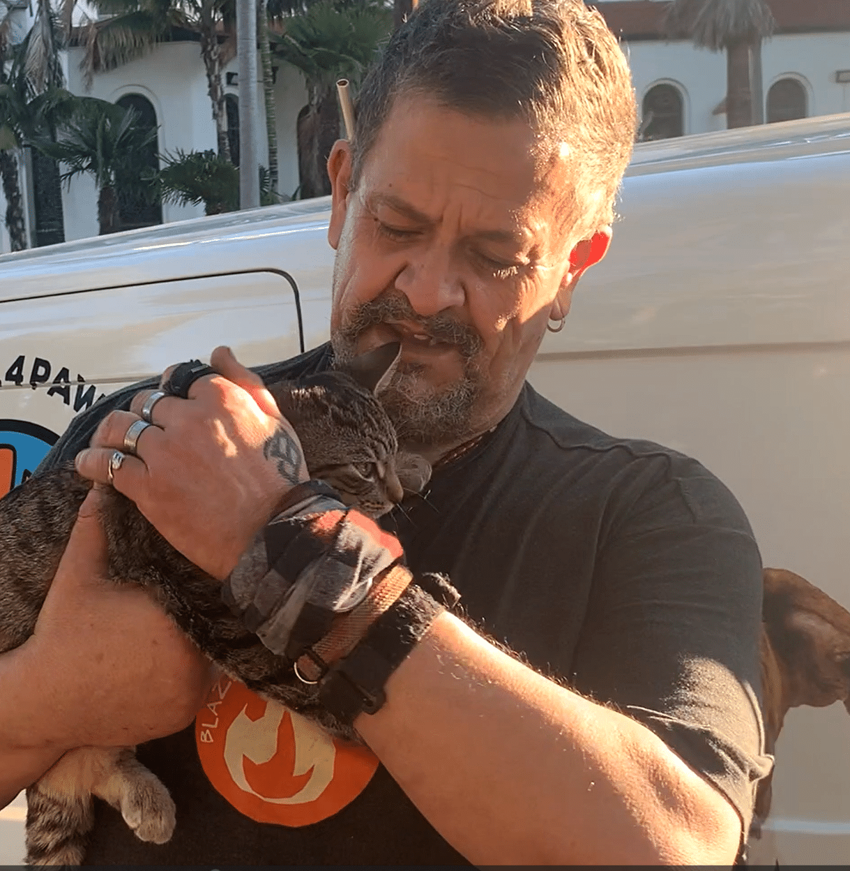 Man with his pet at a C.A.R.E.4Paws Mobile Clinic event