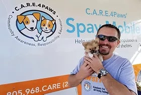 C.A.R.E.4Paws Mobile Pet Clinic veterinarian with tiny puppy
